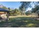 Spacious backyard with a view of a large pasture at 2821 Se 80Th St, Ocala, FL 34480