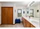Bathroom features double vanity and large mirror at 2821 Se 80Th St, Ocala, FL 34480