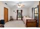 Bright bedroom featuring a twin bed and rocking chair at 2821 Se 80Th St, Ocala, FL 34480