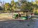 Oversized equipment shed with tractor and other equipment at 2821 Se 80Th St, Ocala, FL 34480