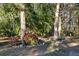 Landscaped garden with vibrant poinsettias and other plants at 2821 Se 80Th St, Ocala, FL 34480