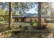 Brick house with covered patio and well-manicured landscaping at 2821 Se 80Th St, Ocala, FL 34480
