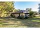 Brick home with mature shrubs and expansive lawn at 2821 Se 80Th St, Ocala, FL 34480