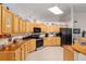 Bright kitchen with stainless steel appliances and wood cabinets at 2821 Se 80Th St, Ocala, FL 34480