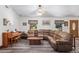 Spacious living room with large sectional sofa and wood floors at 2821 Se 80Th St, Ocala, FL 34480