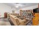 Living room with sectional sofas and built-in shelving at 2821 Se 80Th St, Ocala, FL 34480