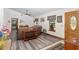 Living room with sectional sofa and access to the dining area at 2821 Se 80Th St, Ocala, FL 34480