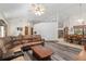 Open living room with sectional sofa and views to dining area at 2821 Se 80Th St, Ocala, FL 34480