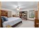 Main bedroom with a king-size bed and built-in bookshelves at 2821 Se 80Th St, Ocala, FL 34480