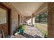 Covered porch with rocking chairs and views of the yard at 2821 Se 80Th St, Ocala, FL 34480
