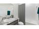 Modern bathroom with granite vanity, shower/tub combo and gray accents at 3083 Canopy Oak Blvd, Wildwood, FL 34785