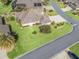 Property's backyard, showcasing lush landscaping and neighborhood views at 3416 Eisenhower Way, The Villages, FL 32163