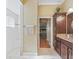 Elegant bathroom with granite countertops and walk-in shower at 3416 Eisenhower Way, The Villages, FL 32163