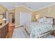 Guest bedroom with wood floors and ceiling fan at 3416 Eisenhower Way, The Villages, FL 32163