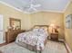Charming bedroom with wood floors and ceiling fan at 3416 Eisenhower Way, The Villages, FL 32163