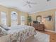 Bedroom with bay window and ceiling fan at 3416 Eisenhower Way, The Villages, FL 32163
