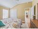 Bright bedroom with wood floors and double doors at 3416 Eisenhower Way, The Villages, FL 32163