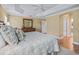 Bright bedroom with large bed and ensuite access at 3416 Eisenhower Way, The Villages, FL 32163