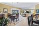 Bright dining room featuring a large table and view to the living room at 3416 Eisenhower Way, The Villages, FL 32163