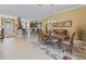 Elegant dining room with kitchen view, perfect for entertaining at 3416 Eisenhower Way, The Villages, FL 32163