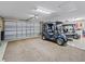Large garage with space for two golf carts and extra storage at 3416 Eisenhower Way, The Villages, FL 32163