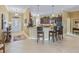 Kitchen with breakfast bar and ample cabinetry at 3416 Eisenhower Way, The Villages, FL 32163