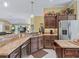 Kitchen with stainless steel appliances, granite countertops, and an island at 3416 Eisenhower Way, The Villages, FL 32163
