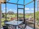 Enjoy this screened patio with golf course views at 3416 Eisenhower Way, The Villages, FL 32163