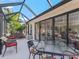 Relaxing screened patio with outdoor furniture and golf course view at 3416 Eisenhower Way, The Villages, FL 32163
