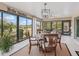 Sunroom with golf course views and plenty of natural light at 3416 Eisenhower Way, The Villages, FL 32163