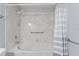 Bathroom with bathtub and shower, and striped curtain at 4480 Nw 79Th Terrace Rd, Ocala, FL 34482
