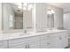 Double vanity bathroom with white cabinets and quartz countertops at 4480 Nw 79Th Terrace Rd, Ocala, FL 34482