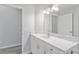 Bathroom with white vanity and large mirror at 4480 Nw 79Th Terrace Rd, Ocala, FL 34482