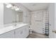 Bathroom with white vanity, bathtub, and shower at 4480 Nw 79Th Terrace Rd, Ocala, FL 34482