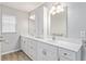 Bathroom boasts double vanity, white cabinets, and quartz countertop at 4480 Nw 79Th Terrace Rd, Ocala, FL 34482