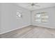 Bedroom featuring wood-look floors and a ceiling fan at 4480 Nw 79Th Terrace Rd, Ocala, FL 34482