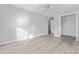 Bright bedroom with wood-look floors and a spacious closet at 4480 Nw 79Th Terrace Rd, Ocala, FL 34482