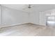 Large bedroom with wood-look floors and access to another room at 4480 Nw 79Th Terrace Rd, Ocala, FL 34482