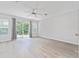 Spacious bedroom with wood-look floors and sliding glass doors to backyard at 4480 Nw 79Th Terrace Rd, Ocala, FL 34482