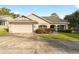Single-story home with attached garage and landscaped yard at 4480 Nw 79Th Terrace Rd, Ocala, FL 34482