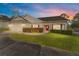 Attractive house exterior with a red door and well-maintained landscaping at 4480 Nw 79Th Terrace Rd, Ocala, FL 34482