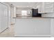Updated kitchen featuring white cabinets and granite countertops at 4480 Nw 79Th Terrace Rd, Ocala, FL 34482