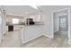 Modern kitchen with white cabinets, granite counters, and stainless steel appliances at 4480 Nw 79Th Terrace Rd, Ocala, FL 34482