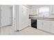 Modern kitchen with white cabinets and granite countertops at 4480 Nw 79Th Terrace Rd, Ocala, FL 34482