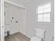 Convenient laundry room with utility sink and toilet at 4480 Nw 79Th Terrace Rd, Ocala, FL 34482