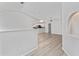 Spacious living room with vaulted ceilings and luxury vinyl plank flooring at 4480 Nw 79Th Terrace Rd, Ocala, FL 34482