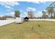 Large backyard with a white fence, offering plenty of space for outdoor activities at 4880 Sw 106Th St, Ocala, FL 34476
