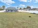Large, expansive backyard with a screened-in pool, perfect for outdoor entertaining at 4880 Sw 106Th St, Ocala, FL 34476
