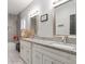 Bathroom with granite countertops and double sinks at 4880 Sw 106Th St, Ocala, FL 34476