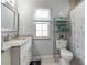 Bathroom with single vanity, shower and toilet at 4880 Sw 106Th St, Ocala, FL 34476